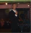 Comedian Mick Martin performing on the stage of the variety club Radford Notts